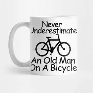 never understimate an oldman on a bicycle black Mug